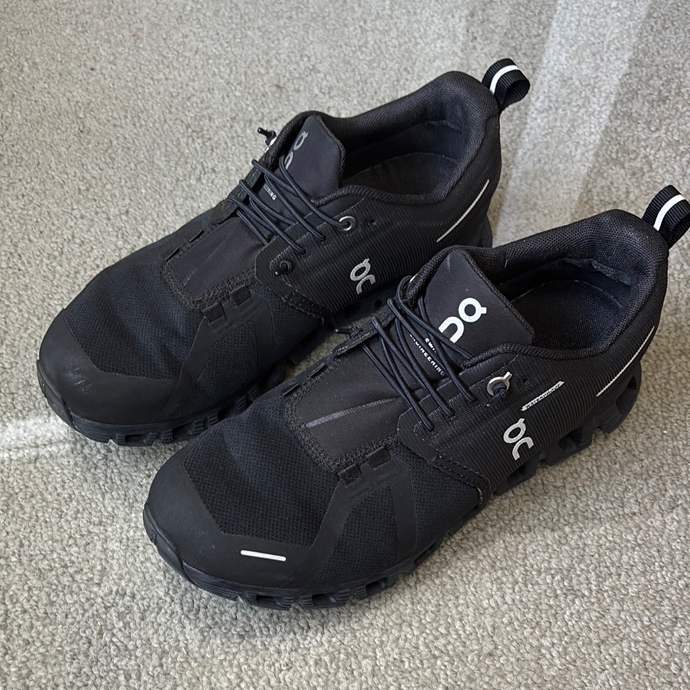 On Running Black Athletic Shoes with Sleek Design